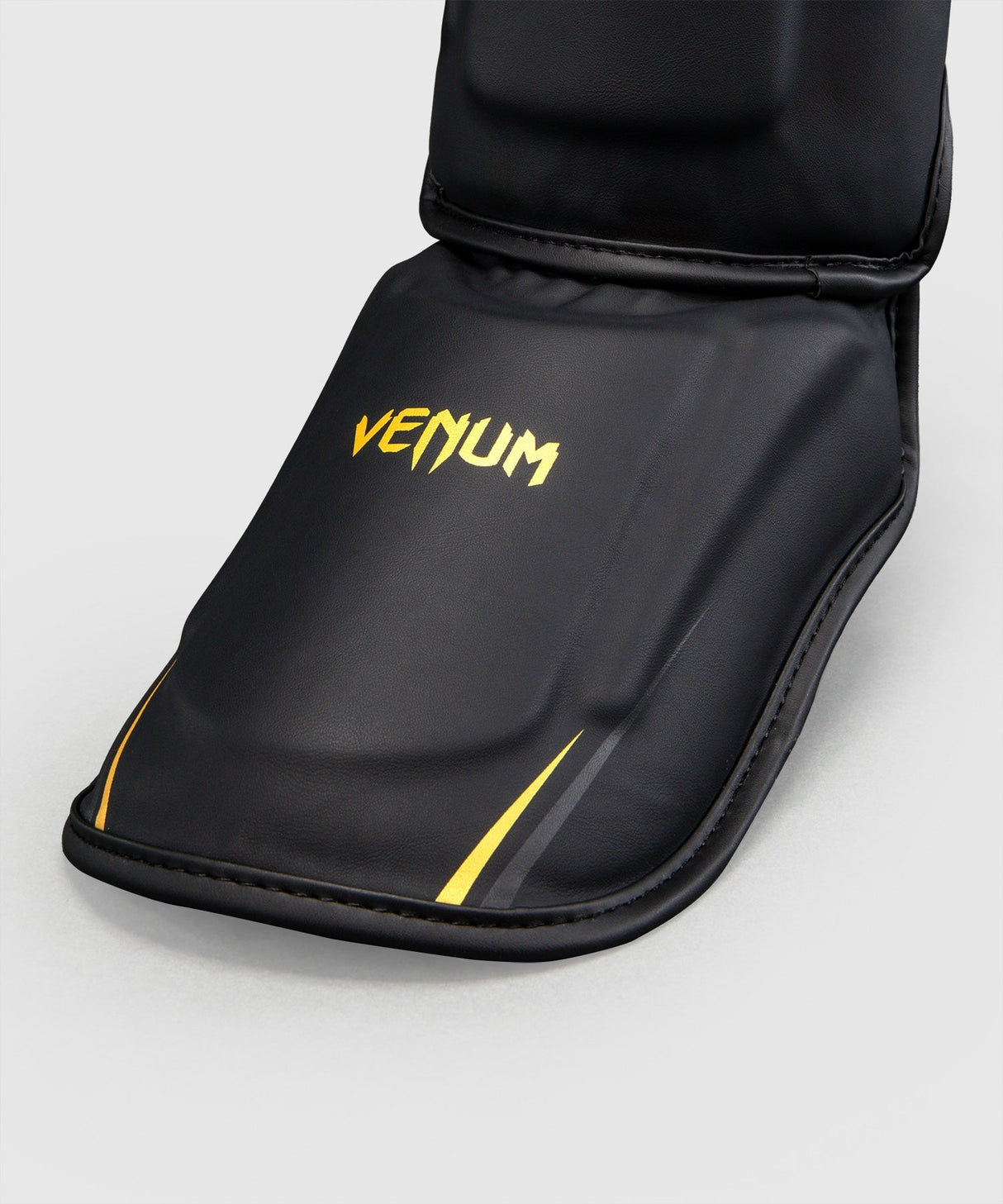 Venum Schienbeinschoner G-Core – Schwarz/Gold