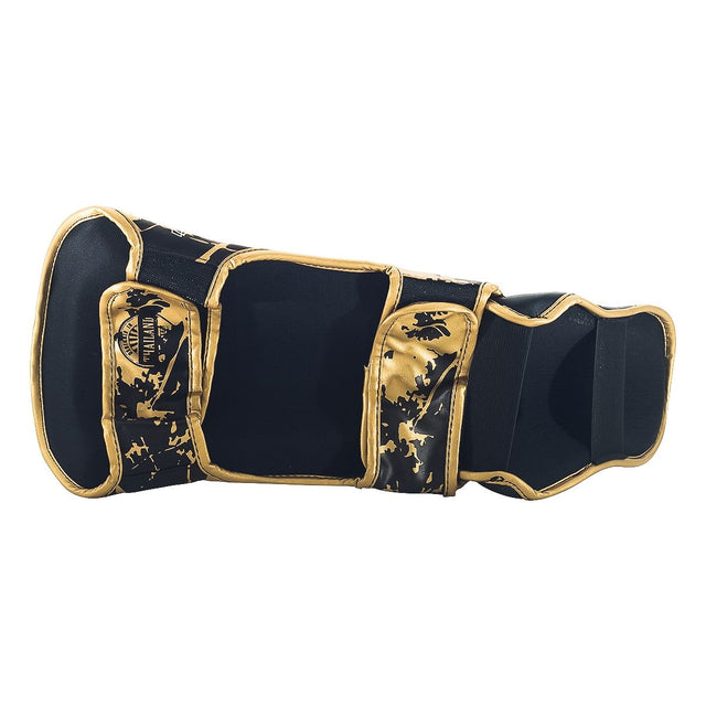 Booster Schienbeinschoner Kinder Marble – Schwarz/Gold