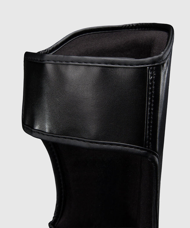 Ringhorns Schienbeinschoner Charger - Schwarz/Gold