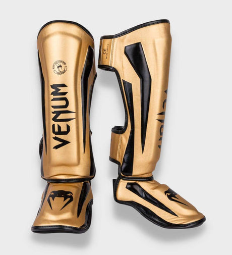 Venum Schienbeinschoner Elite - Gold/Schwarz - The Fight Company Deutschland