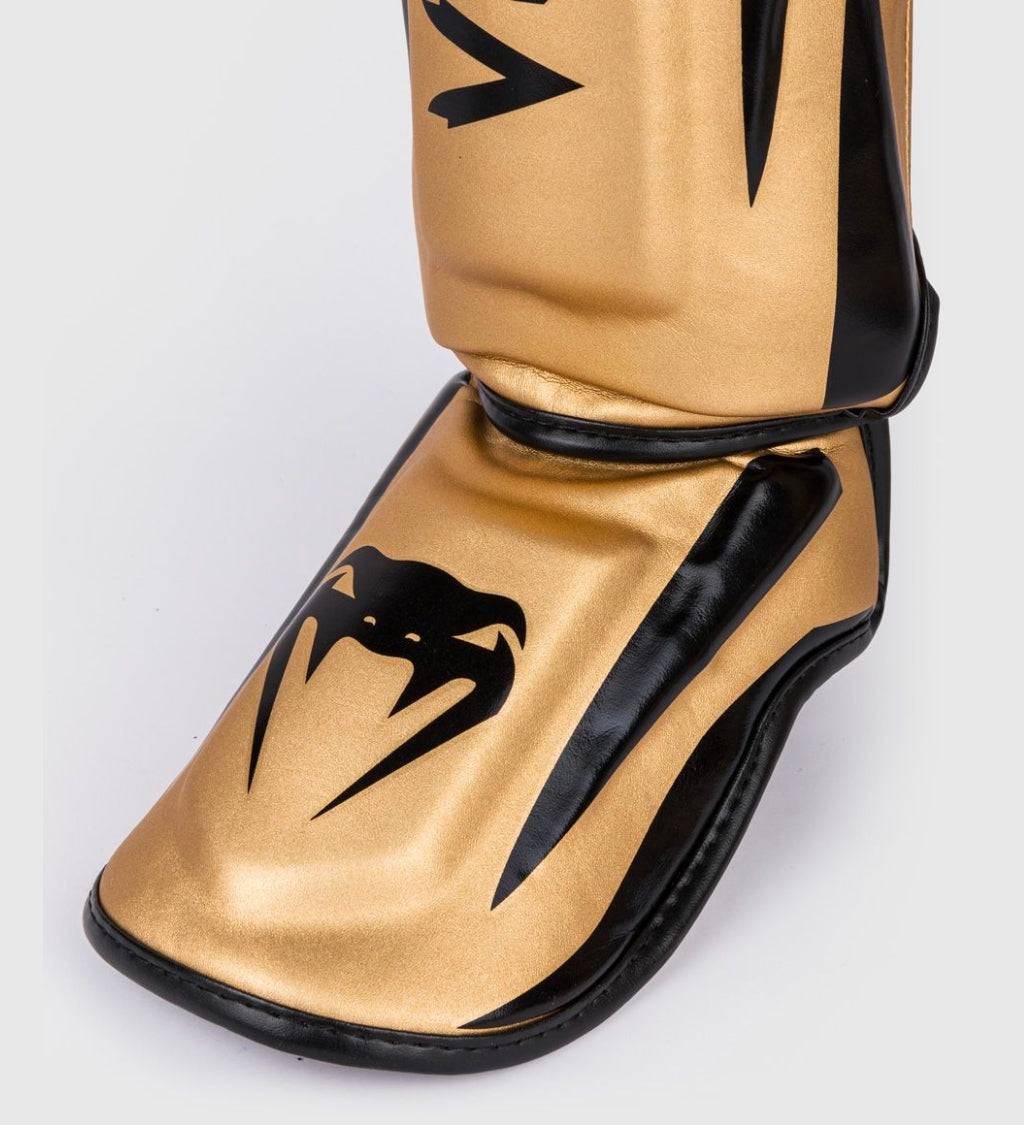 Venum Schienbeinschoner Elite - Gold/Schwarz - The Fight Company Deutschland