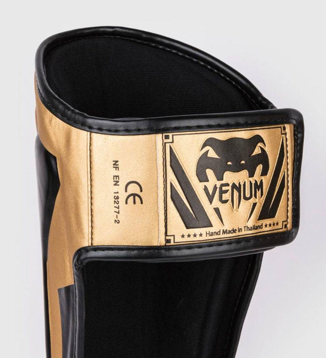 Venum Schienbeinschoner Elite - Gold/Schwarz - The Fight Company Deutschland