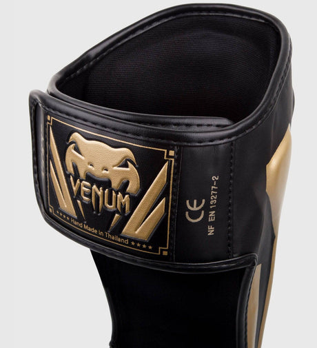 Venum Schienbeinschoner Elite - Schwarz/Gold - The Fight Company Deutschland
